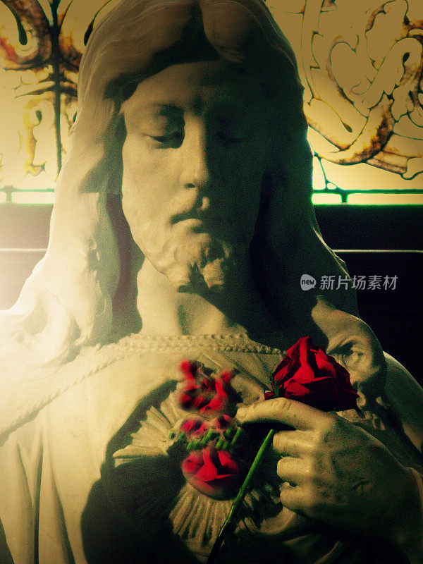 Statue of Jesus Holding Rose, Touching his Red Sacred Heart